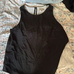 Black and white sleeveless blouse